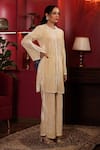 k-anshika_Off White Velvet Embellished Bead Round Kurta And Flared Pant Set _at_Aza_Fashions