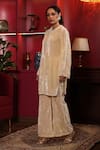 Buy_k-anshika_Off White Velvet Embellished Bead Round Kurta And Flared Pant Set 