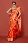 Buy_Pinki Sinha_Orange Banarasi Pure Silk Handwoven Floral Butta Saree With Running Blouse _at_Aza_Fashions