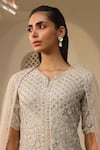 Buy_SAISHA_Ivory Net Embroidery Sequin Leaf Neck Scallop Peplum Kurta Sharara Set _Online_at_Aza_Fashions