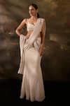 Buy_SAANJH BY LEA_Off White Aartika Shimmery Pleated Embellished Pre-draped Saree With Blouse _at_Aza_Fashions