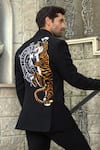 Shop_Courtyard by abhi_Black Japenese Lycra Graffiti Pattern Tuxedo Trouser Set _at_Aza_Fashions