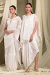 Buy_Tasuvure Indes_Ivory Pleated Polyester Round Pristine Accordion Saree Gown _Online_at_Aza_Fashions