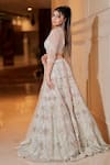 Sidhaarth & Disha_Ivory Net Embroidery Sequin V Neck Chevron Bridal Lehenga Set _at_Aza_Fashions