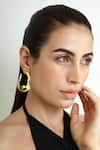 Varnika Arora_Gold Plated Nautica Abstract Wave Hoops _Online_at_Aza_Fashions