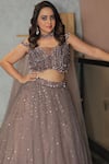 Chaashni by Maansi and Ketan_Brown Net Embroidered Sequins Off Shoulder Cutdana Gradient Lehenga Set _Online