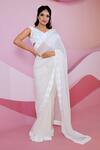 Vedika Soni_Ivory Georgette Hand Embroidered Cutdana One Pre-draped Saree With Blouse _Online_at_Aza_Fashions