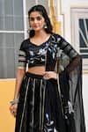SUTI KAPDA_Black Saatan Silk Print Lotus Bloom Paan Neck Lehenga Set _at_Aza_Fashions