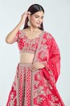 Anushree Reddy_Red Raw Silk Embroidered Floral Cutwork V Leh Nyomaa Bridal Lehenga Set _at_Aza_Fashions