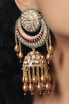 Shop_Joules by Radhika_Gold Plated Polki Pearl Embellished Shimmering Jhumkas _at_Aza_Fashions