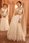 Niamh By Kriti_Ivory Silk Crepe Embellished Wave Pre-draped Lehenga Saree With Crystal Blouse _Online_at_Aza_Fashions