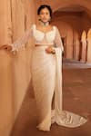 Buy_Niamh By Kriti_Ivory Silk Crepe Embellished Wave Pre-draped Textured Saree With Blouse _Online_at_Aza_Fashions