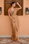 Buy_Nidhi Kejriwal_Brown Tissue Hand Embellished Cutdana Bustier Pre-draped Saree Set With Shrug _at_Aza_Fashions