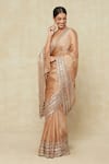 Shop_Seema Gujral_Beige Embroidered Mirror Plunged Bordered Saree With Blouse _Online_at_Aza_Fashions