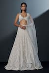 Buy_Ritika Mirchandani_Ivory Crepe Embroidered Crystal Plunging Lehenga Set _at_Aza_Fashions