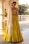 Buy_Paulmi and Harsh_Yellow Silver Jacquard Woven Ambrosia Sweetheart Neck Lehenga Set _at_Aza_Fashions