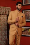 Shop_DESIGN O STITCH_Beige Suiting Embellished Lion Face Buttons Bandhgala With Pant 