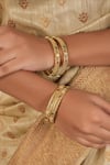 Buy_Smars Jewelry_Gold Plated Stone Studded Jaali Bangles-Set of 4 _at_Aza_Fashions