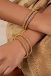 Buy_Smars Jewelry_Gold Plated Carved Jaali Bangles-Set of 4 _at_Aza_Fashions