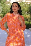 Shop_MEHER BY ISLIE_Orange Natural Crepe Print Floral High Round Harem Jumpsuit _Online_at_Aza_Fashions