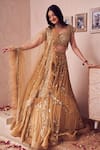 Swish By Dolcy And Simran_Gold Net Embroidery Sequin Sweetheart Neck Royale Ambrosia Bridal Lehenga Set _Online_at_Aza_Fashions