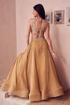 Shop_Swish By Dolcy And Simran_Gold Georgette Lining Marigold Layered Tassel Embellished Lehenga With Blouse _at_Aza_Fashions