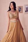 Buy_Swish By Dolcy And Simran_Gold Georgette Lining Marigold Layered Tassel Embellished Lehenga With Blouse _Online_at_Aza_Fashions