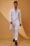 Shop_MENERO_White Pure Crepe Lycra Embroidered Pita Floral Work Kurta And Pant Set _at_Aza_Fashions