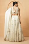 Shop_Quench A Thirst_Ivory Modal Satin Embellished Pearl V Neck Lehenga Set _at_Aza_Fashions