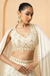 Shop_Quench A Thirst_Ivory Modal Satin Embellished Pearl V Neck Lehenga Set _Online_at_Aza_Fashions