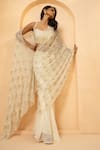 Quench A Thirst_Ivory Georgette Embellished Cutdana Pearl Pre-stitched Saree With Blouse _Online_at_Aza_Fashions