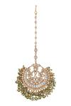 Shop Riana Jewellery Green Jadtar Stone Embellished Carved Maangtikka at Aza Fashions Shop_Riana Jewellery_Green Jadtar Stone Embellished Carved Maangtikka _at_Aza_Fashions