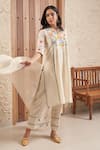 Buy_Samatvam by Anjali Bhaskar_Beige Embroidery Applique Notched Bella Floral Kurta And Pant Set 