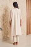 Shop_Samatvam by Anjali Bhaskar_Ivory Chanderi Embroidery Floral Round Ishani Asymmetric Kurta With Pant _at_Aza_Fashions