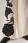 Shop_ATBW_White Raw Silk Satin Embellished Flower Detailed Flared Pant _Online_at_Aza_Fashions