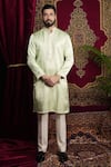 Sven suits_Green Faux Silk Embroidery Thread Mirror Hand Kurta Set _at_Aza_Fashions