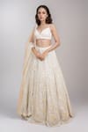 Buy_Seema Gujral_Ivory Net Embroidered Floral Plunged Sequin Embellished Bridal Lehenga Set _at_Aza_Fashions