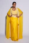 Buy_ASHUTOSH JOSHI_Yellow Net Hand Embroidered Circle Bustier U Neck Sufi Sharara Set With Cape _at_Aza_Fashions