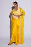 Buy_ASHUTOSH JOSHI_Yellow Net Hand Embroidered Circle Bustier U Neck Sufi Sharara Set With Cape _Online_at_Aza_Fashions