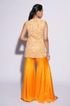 Shop_ASHUTOSH JOSHI_Orange Net Hand Embroidered Abstract Cutwork V-neck Sai Kurta Sharara Set _at_Aza_Fashions