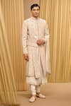 Tarun Tahiliani_Ivory Raw Silk Hand Embroidered Gold Zari Sherwani Set _Online_at_Aza_Fashions