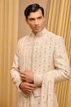 Shop_Tarun Tahiliani_Ivory Raw Silk Hand Embroidered Gold Zari Sherwani Set _Online_at_Aza_Fashions