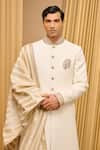 Tarun Tahiliani_Ivory Textured Fabric Embroidered Paisley Placed Sherwani Set _at_Aza_Fashions