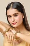 Buy_Nazaakat By Samara Singh_Gold Plated Stones Carved Peacock Floral Bangles-Set of 2 _at_Aza_Fashions