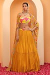 Buy_SWATI WADHWANI COUTURE_Yellow Crepe Embellished Floral Blouse Ruhani Printed Cape With Lehenga Set _at_Aza_Fashions