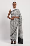 Buy_ABRAHAM AND THAKORE_Ivory Satin Printed Broken Lines Sequin Embroidered Saree _at_Aza_Fashions