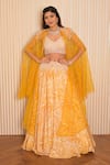 Buy_VRIDHI SOMAANI_Yellow Silk Crepe Printed Tropical Blouse V-neck Yaffira Lehenga And Cape Set _at_Aza_Fashions