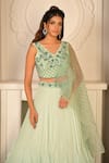 Buy_VRIDHI SOMAANI_Green Organza Embroidered Floral Castelle Ruffle Lehenga Saree And Blouse Set _Online_at_Aza_Fashions