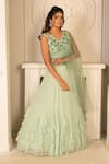 Shop_VRIDHI SOMAANI_Green Organza Embroidered Floral Castelle Ruffle Lehenga Saree And Blouse Set _Online_at_Aza_Fashions