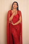 Buy_VRIDHI SOMAANI_Red Net Hand Embroidered Sequins Blouse Sweetheart Rosie Pant Set With Cape _Online_at_Aza_Fashions